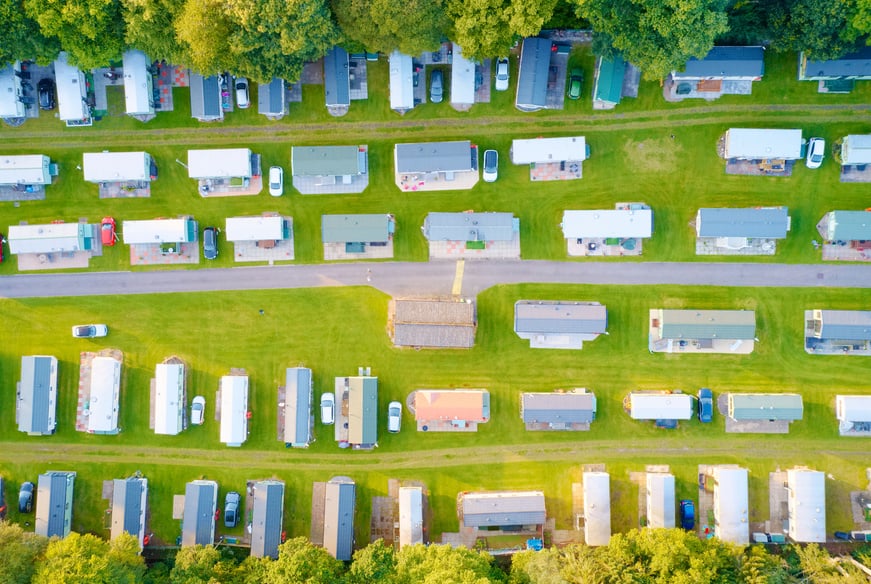 Caravan site park aerial view illuminated by summer sun